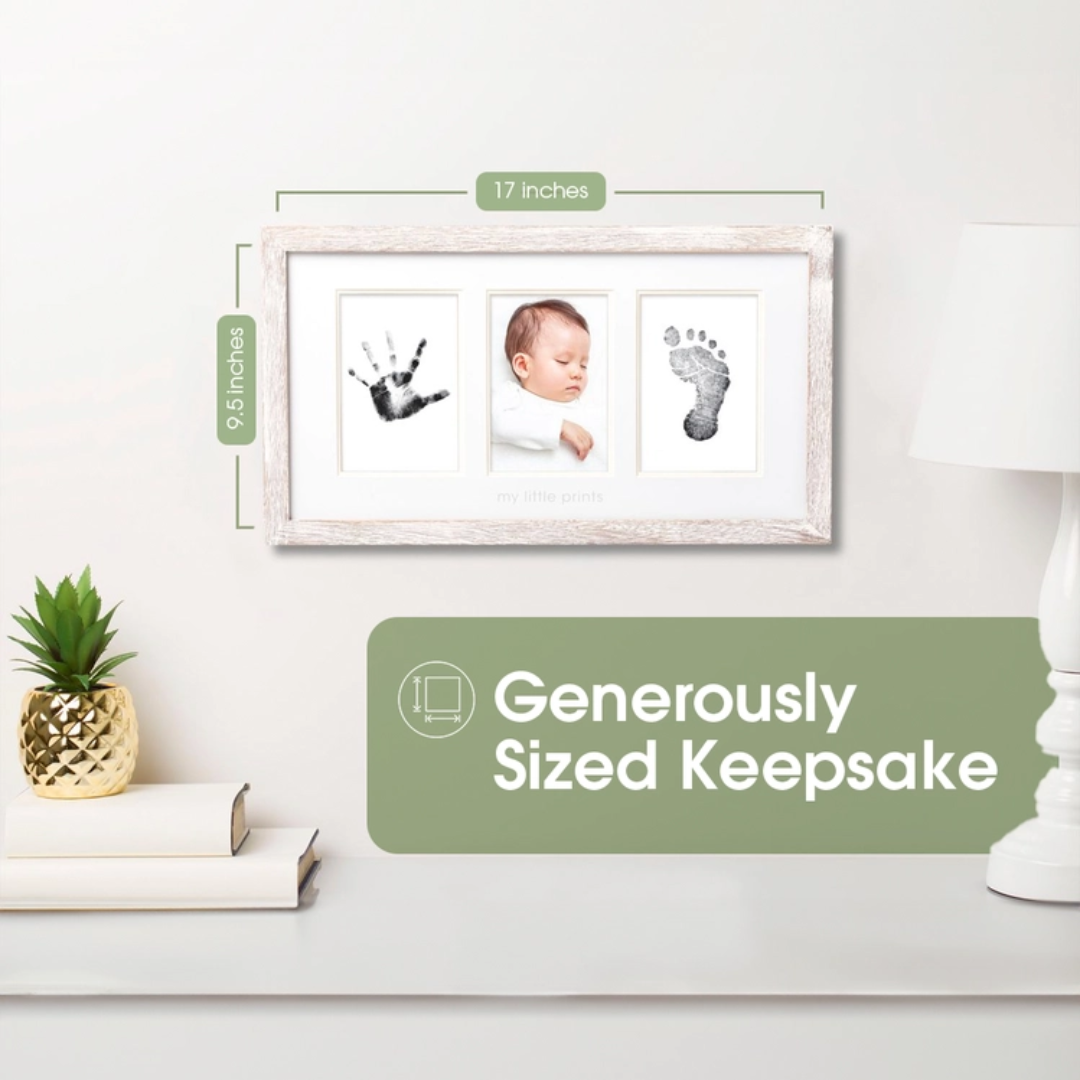 Rustic baby handprint frame placed on a wooden shelf with plants and nursery books for home décor styling.