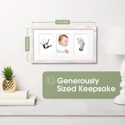 Rustic baby handprint frame placed on a wooden shelf with plants and nursery books for home décor styling.