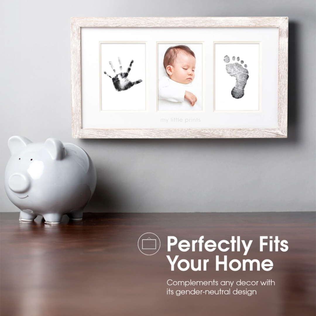 Rustic wood frame displaying two newborn photos alongside a perfectly captured baby handprint.