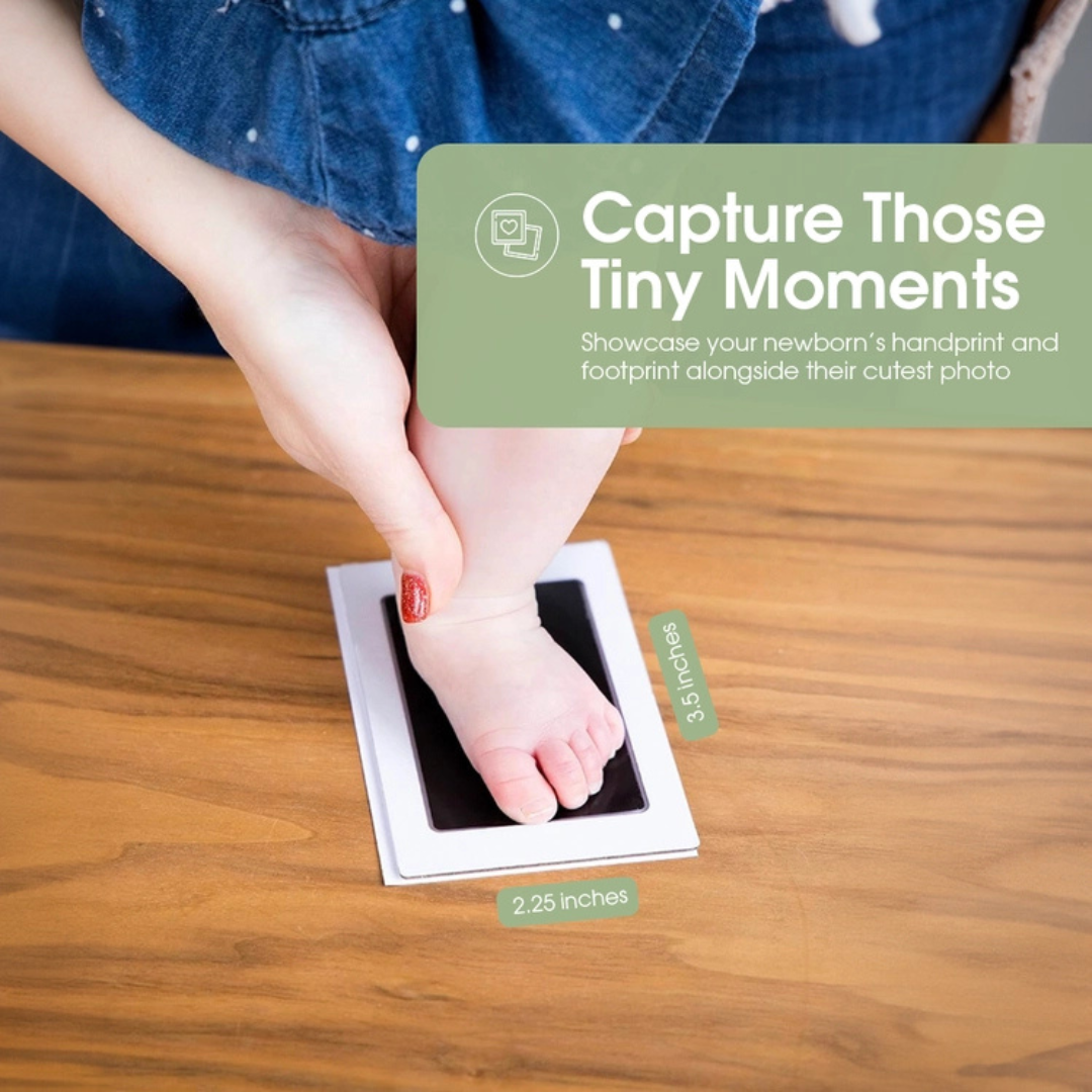 Parent gently pressing baby’s foot onto clean-touch ink pad to create a mess-free footprint.