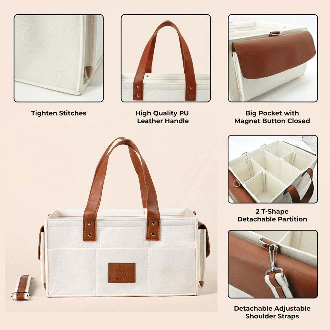 Cream tote bag with brown leather handles and compartments on a beige background